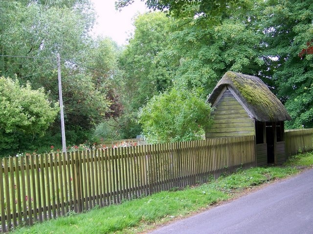 Thatched bus shelter, Boyton The bus shelter is near the Ginger Piggery.