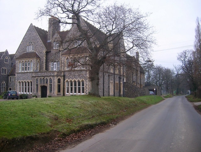 Hurstpierpoint College Built in 1851-53, St John's was designed by R C Carpenter who was also responsible for Lancing College. The knapped flint buildings give it a forbidding look which may have been the original intention. Looking up College Lane to its junction with Chalkers Lane. Beyond that the it becomes Malthouse Lane and continues on to Burgess Hill.