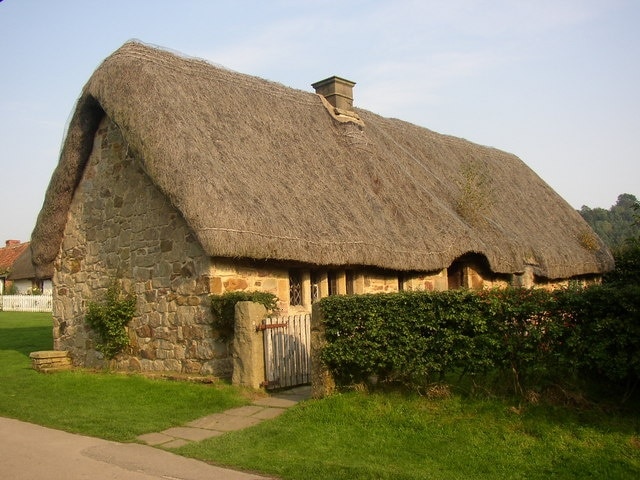 Cruck-framed cottage from Stang End, Ryedale Folk Museum, Hutton-le-Hole. This cottage stood for 500 years in Danby, and was moved to the museum in 1967-8. It has been restored to how it was in 1704, when it was extended from one room shared with animals to a proper house with a forehouse (living-room and kitchen), dairy and a parlour / bedroom.