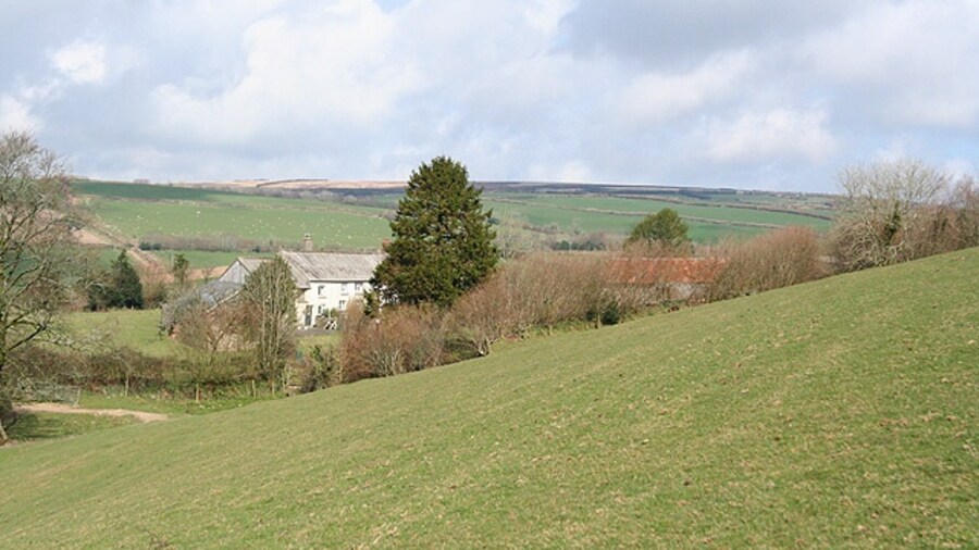 Photo "Molland: Lower Hill Looking north-north-west towards a relatively remote Exmoor farm. Only two barns survive at neighbouring Higher Hill  the farmhouse has gone" by Martin Bodman (Creative Commons Attribution-Share Alike 2.0) / Cropped from original