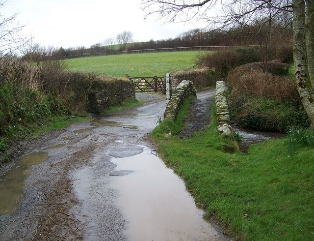 Footbridge and track to Easter Ground Cottage The rutted track leads to farm buildings and some remote cottages.