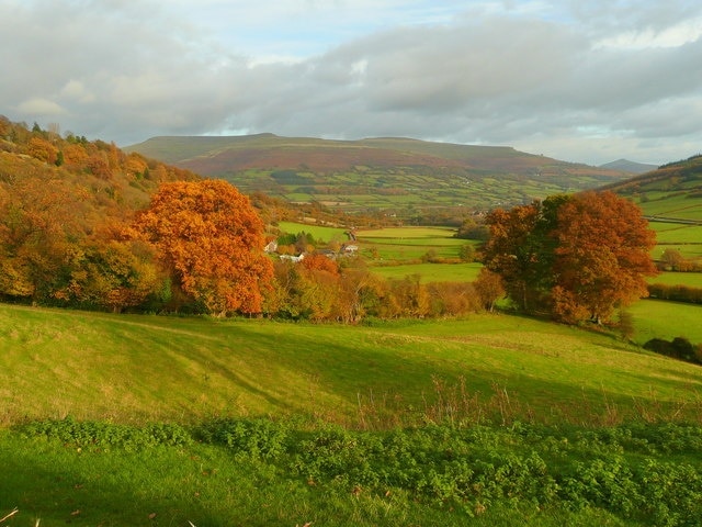 View east from Bwlch 2 A fine view across the Rhiangoll valley to the twin tops of the Black Mountains and Sugarloaf to the right. In golden afternoon light.