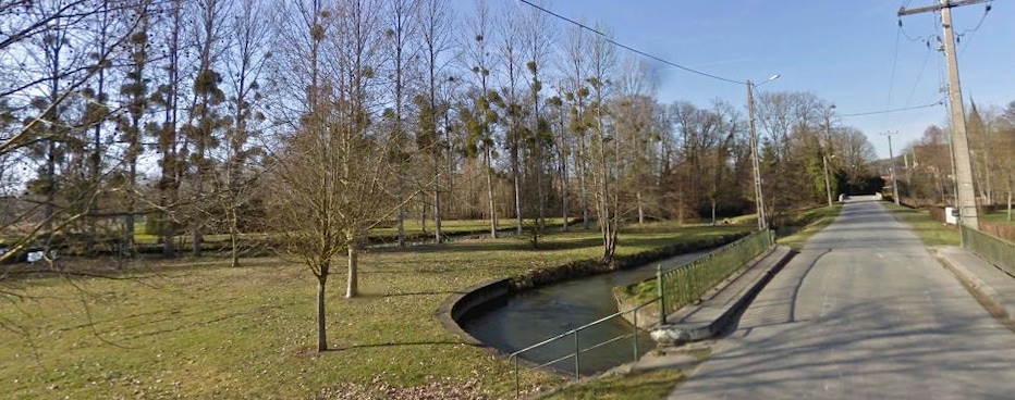 The Ouanne river at Triguères, Loiret, France. The photo is taken by the second bridge of the route de Melleroy as we leave the village, looking towards the north. The general flow of the river goes west (on the left here), but it meanders a lot and splits into many arms. This portion of the river is actually running east (towards the right here), and turns around behind us to flow west again. Thus there is a third bridge behind us to allow for the passing of this meander.