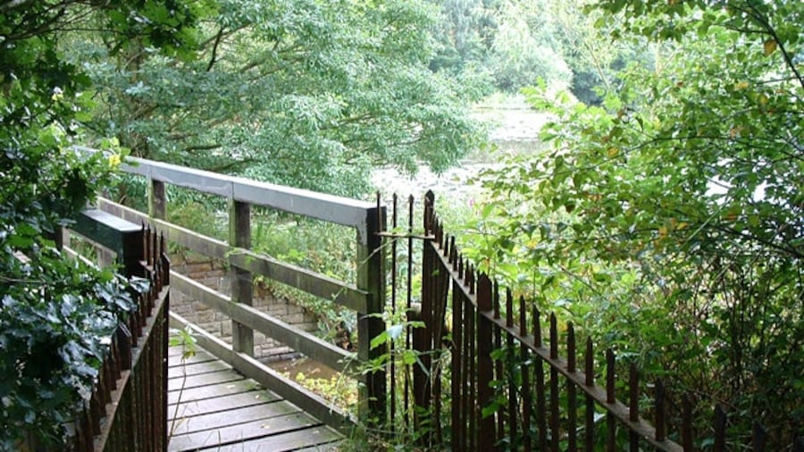 Photo "Footbridge at Worthington Lake Reservoir. Situated at the North end of Worthington Lake - a minor reservoir - this footbridge maintains an ancient right of way across the head of a flooded valley." by David Hignett (Creative Commons Attribution-Share Alike 2.0) / Cropped from original