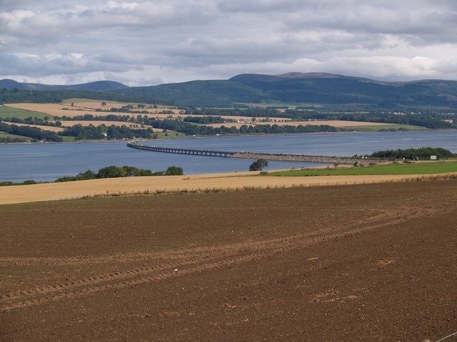 Cromarty Firth and Bridge Looking over some fields next to the A9 towards the Cromarty Firth and Bridge.