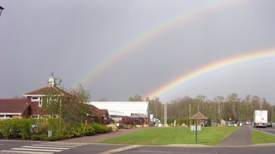 Photo "Longacres Nurseries at the end of the rainbow. A very good clear double rainbow in the spring sunshine." by Jonathan Billinger (Creative Commons Attribution-Share Alike 2.0) / Cropped from original