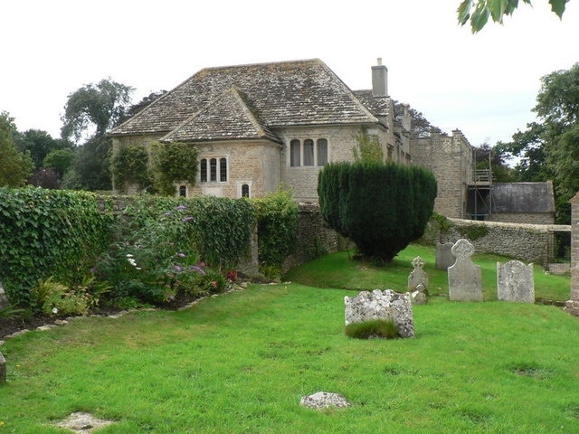 Puncknowle: the manor house A peek at the Puncknowle Manor over the churchyard wall.