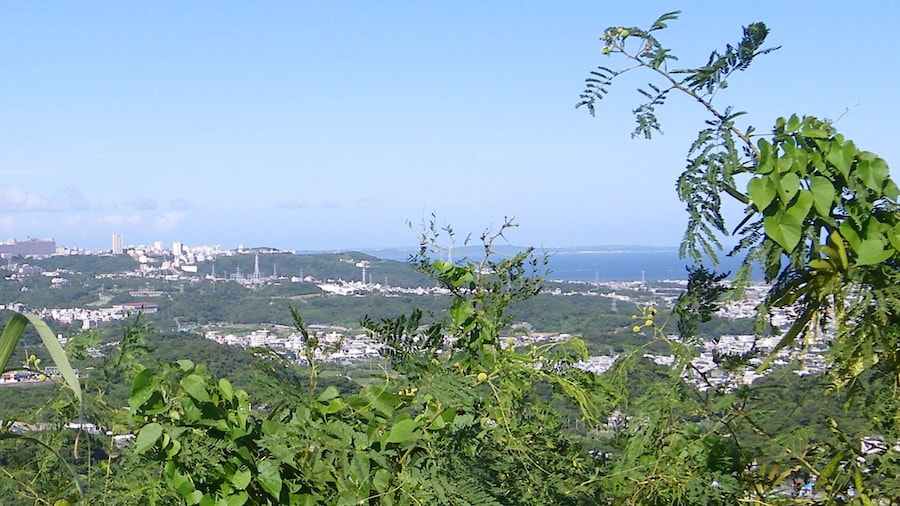 Photo "Panoramic view for Nishihara Town, taken from Fītatimō, a hill nearby Bengadake, Naha, Okinawa, Japan." by Kugel~commonswiki (Creative Commons Attribution-Share Alike 4.0) / Cropped from original