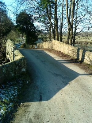 View over North Bridge The road over this fine late 18thC bridge now only serves as the access to Hungate farm.
