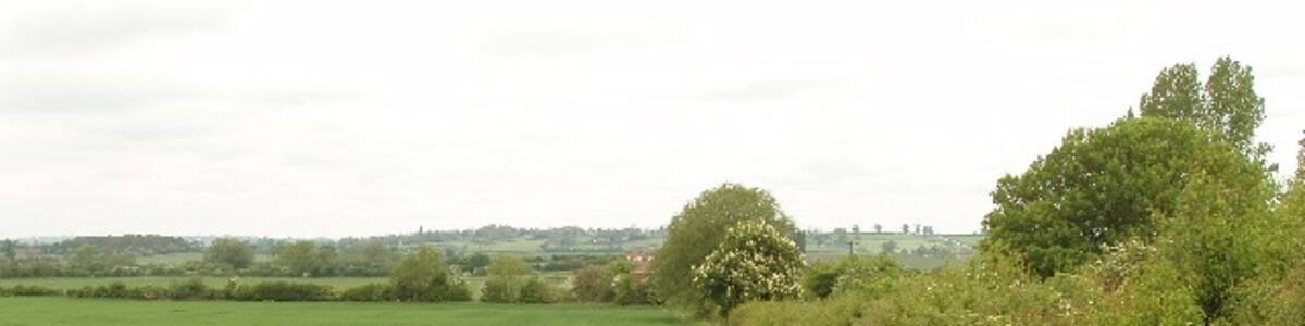 Photo "Wheat field Next to the track to Grendon Hill Farm" by David Hawgood (Creative Commons Attribution-Share Alike 2.0) / Cropped from original