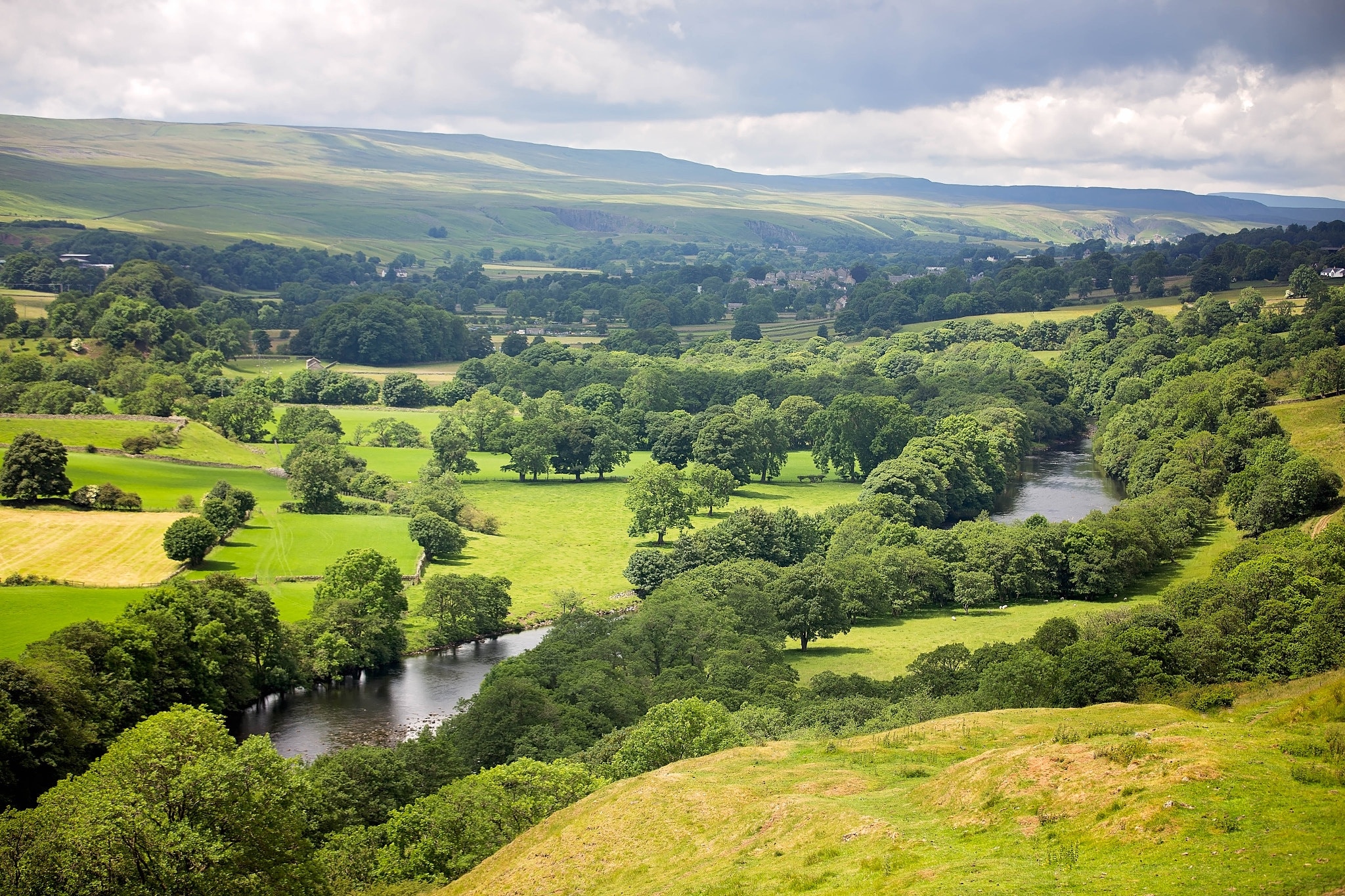 500px provided description: Teesdale, England [#field ,#sky ,#landscape ,#nature ,#travel ,#tree ,#summer ,#grass ,#wood ,#countryside ,#mountain ,#valley ,#cloud ,#hill ,#panoramic ,#rural ,#outdoors ,#horizontal ,#idyllic ,#hayfield ,#Teesdale]