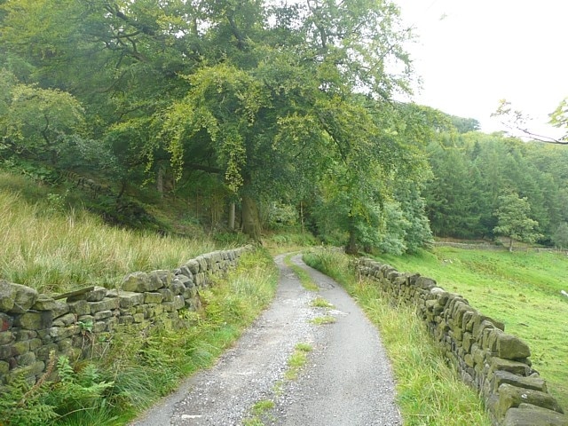 Lane to Higher House, Mytholmroyd Not named on the map and only a public footpath. This is looking down past the lower edge of Hove Yard Wood towards Cragg Vale.