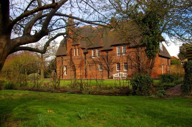 Red House A view from the garden in early spring, of the house designed for William Morris by his friend Philip Webb.