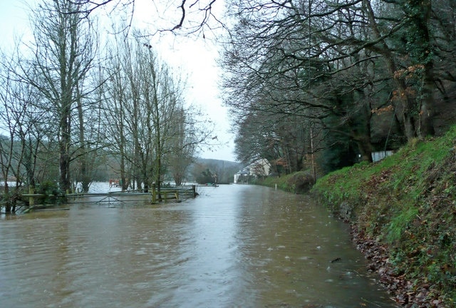 Flooded Torridge at Weare Giffard Invading the valley road and cutting the village in half. This isn't the river; it's the road!