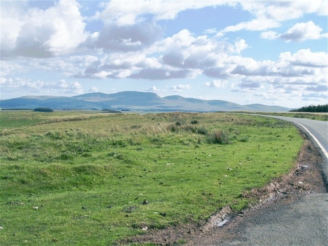 Mynydd Bwlch-y-Groes An anonymous part of the M.O.D training area at the roadside competes for attention with the Carmarthen Fans on the horizon.