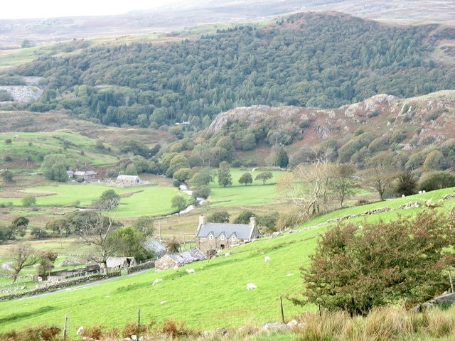 Fferm Isallt-fawr Isallt-fawr is a large farm on the slope below Moel Isallt. The photo also shows Afon Dwyfor and the parish church of Llanfihangel y Pennant.