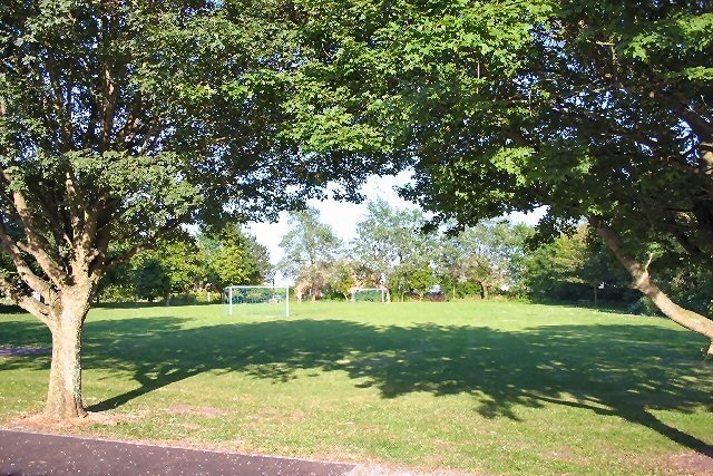 Brockley Green playing field. A small playing field, with a half-size football pitch, viewed from the village hall.