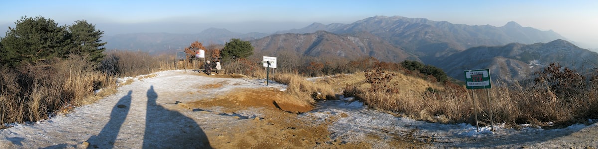 Photo "Panoramic View at Peak of Yumyeong Mountain" by G43 (Creative Commons Attribution 3.0) / Cropped from original