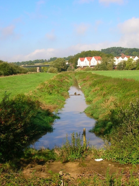 Drainage Channel, Pulborough. The Arun is tidal as far as Pulborough and this is a cut made in the watermeadows to the south of the town to prevent the problem of flooding. This channel isn't marked on the 1940s map so I'm assuming it has been cut after the Second World War. The bridge in the background carries the Arun Valley railway over the river.