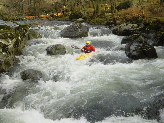 Funnel Steps, Middle Duddon. Funnel Steps is the second grade IV- rapid on the Middle River Duddon, where a boulder garden drops the paddler down four steps into a small gorge. Either side of the top boulder is possible, after which one runs near the centre, avoiding some of the stoppers to maintain speed to get through the bottom, river-wide one. This top section is only grade 3, the sting in the tail being the entry to the gorge just ahead of the paddler 1229990.