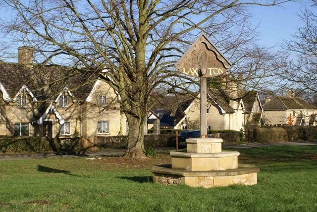 Village sign and estate houses at Laxton