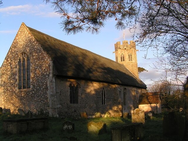 Theberton Church, near to Theberton, Suffolk, Great Britain. Early morning light cast shadows on the church. This picture is viewed from a corner that allows access to the village hall.