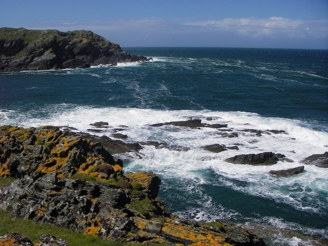 Headland and tidal rocks at Port an Obain Small rocky headland and tidal rocks at the mouth of Port an Obain comprising all of the small amount of land in square NM 4000