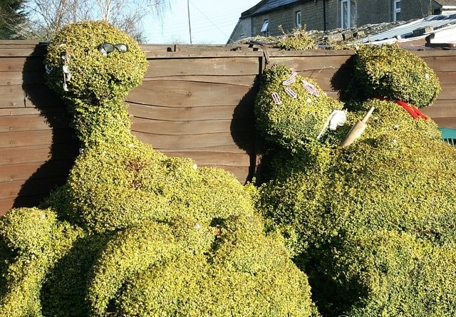 What do you think of it so far? Topiary at Little Marsh. Not sure what the figure on the right represents but note the rolling pin.