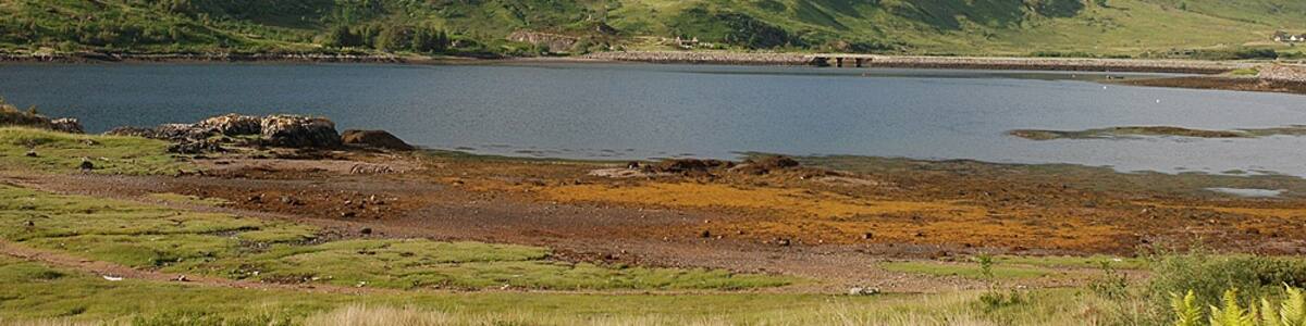 Photo "The eastern end of Loch Duich" by Nigel Brown (Creative Commons Attribution-Share Alike 2.0) / Cropped from original