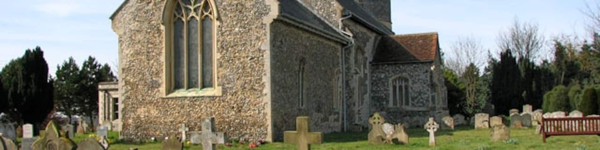 The church of St Remigius in Roydon. The church of St Remigius > 1770044 has a round Norman tower with the top section and parapet added in Victorian times > 1770049. Nave and arcade date from the 13th century, the chancel was added a century later. The elaborately carved pulpit > 1770055 is Jacobean and has an hourglass stand attached to it. The church was extensively restored in the 19th century when the south aisle > 1770062 was added. The stained glass > 1770060 dates from that time. What now serves as a vestry on the south side of the chancel is the former medieval south porch.