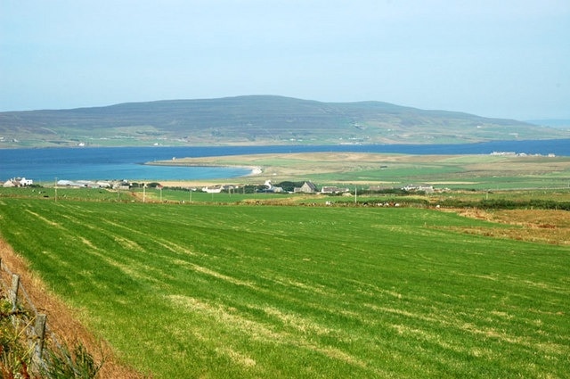 Evie Village from Hillside Road. The island of Rousay in the background