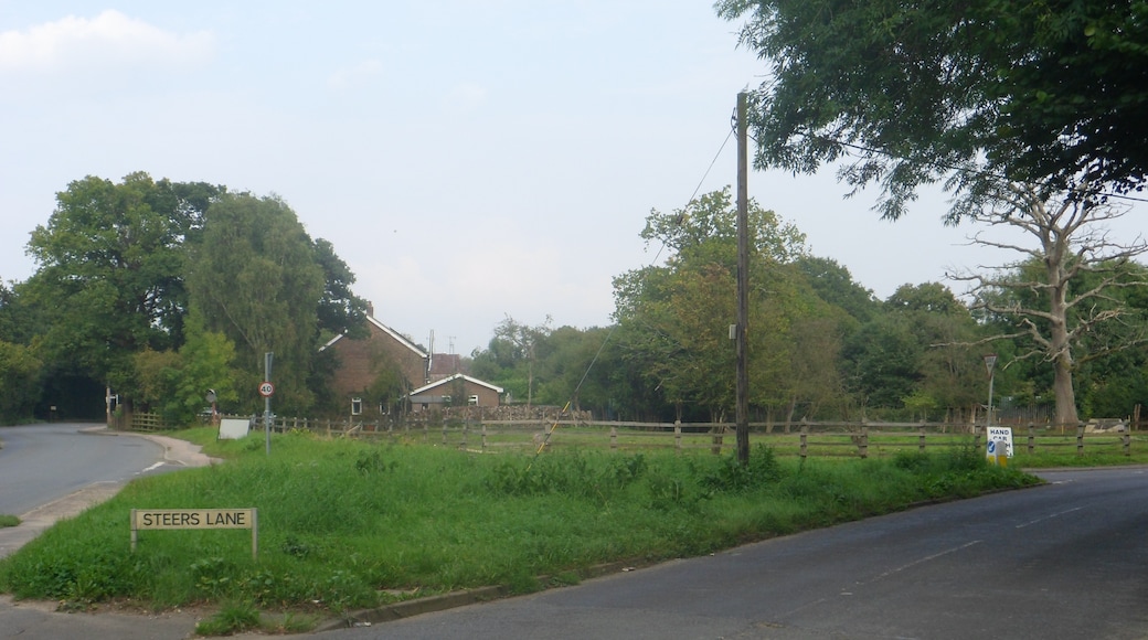 One of a series of photos chronicling the development of Crawley New Town's 14th residential neighbourhood, Forge Wood. This eastward view shows the junction of Radford Road and Steers Lane as it appeared in September 2014, prior to major roadworks which will drastically change its appearance. Radford Road forms the northern limit of the Forge Wood development.