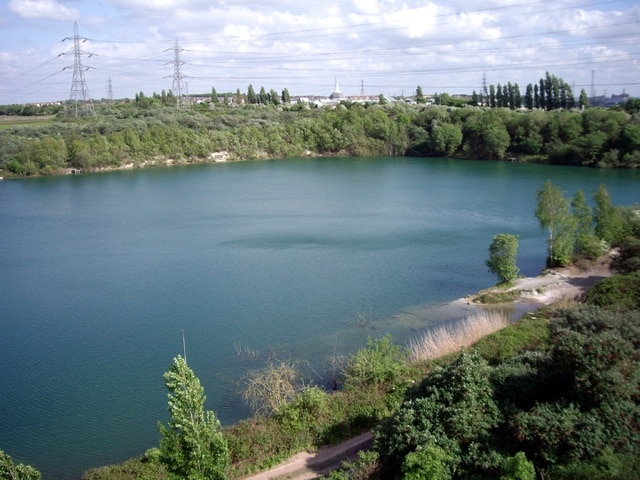 Lake adjacent to Thurrock Motorway Service Area View across the lake (former gravel pit?), looking towards Lakeside shopping centre in the distance.