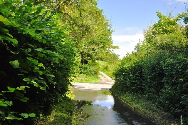 Flooded lane between Sigingstone and Llanmihangel Floodwater pooling at a low point at a road junction.