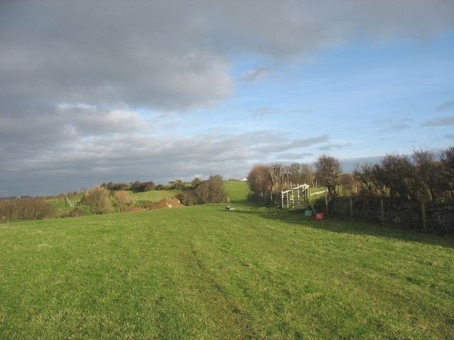 View north-eastwards along the line of the footpath from Plas Llanfaelog to Yr Allt The white gable of Yr Allt cottage can be seen on the skyline.