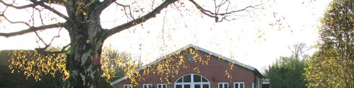 Photo "Mangreen Health & Healing Trust - the Chapel Grounds View across the Chapel Grounds towards the Orchard Rooms. Based in the grounds of Mangreen Hall > 1584173 the Mangreen Trust has provided an oasis of calm and spiritual fulfilment for the past 40 years. The Trust offers attunement healings and Holistic Spirituality day and evening courses as well as workshops. There are an indoor heated swimming pool, organic shop and second hand shop. The Orchard Rooms > 1584196 are purpose-built conference and meeting rooms. The Light Centre > 1584238 - 1584251- a brick-built chapel - is a place of worship with a seating capacity of 80 people. The adjoining small so-called Candle Chapel > 1584227 is open all day and the surrounding chapel grounds and garden > 1584180 invite to meditation and relaxation. http://www.mangreen.co.uk/" by Evelyn Simak (Creative Commons Attribution-Share Alike 2.0) / Cropped from original