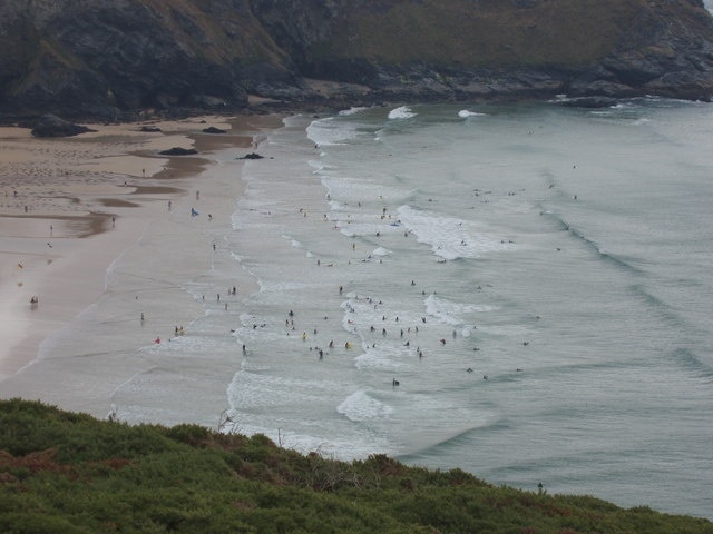 Surfers and bathers, Mawgan Porth. View from the cliff top by Trenance.