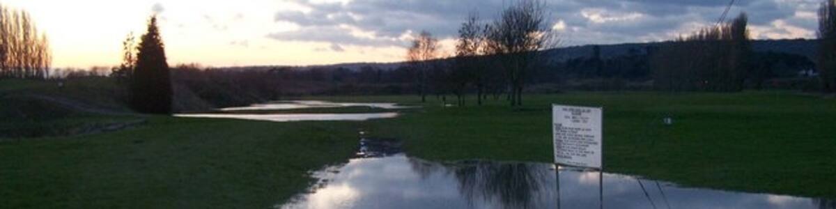 Photo "Flooded Golf Course Golf course suffering from snow melt and winter rains. As seen from footpath through course from Legge Lane to Hays Road." by David Anstiss (Creative Commons Attribution-Share Alike 2.0) / Cropped from original