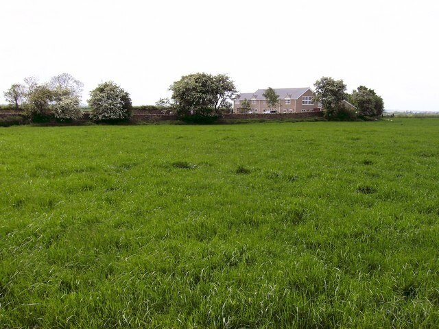 Kirby Farm A modern-looking farm house as seen from the footpath, the course of which has rather worryingly disappeared!