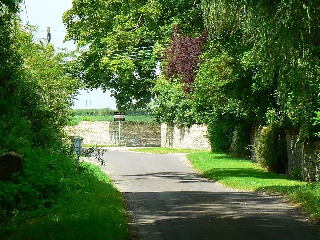 The road through Grafton, Oxfordshire, going northwest to Langford