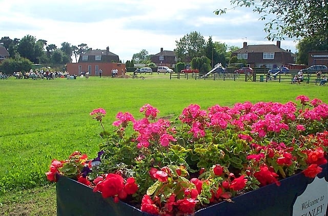 Recreation Ground, w:Stanley Common. A public open space by the side of the main road used by the local community. In winter local football teams play here but in summer it is the occasional venue for open air brass band concerts as can be seen here. w:South Derbyshire