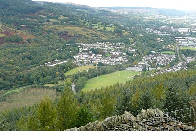 Looking down on Troedrhiw The picture is centred on a sports ground at the southern end of Troedrhiw, know as Mount Pleasant. There is a school just beyond and the railway line can be seen curving round it. The River Taff goes to the left of the playing fields.