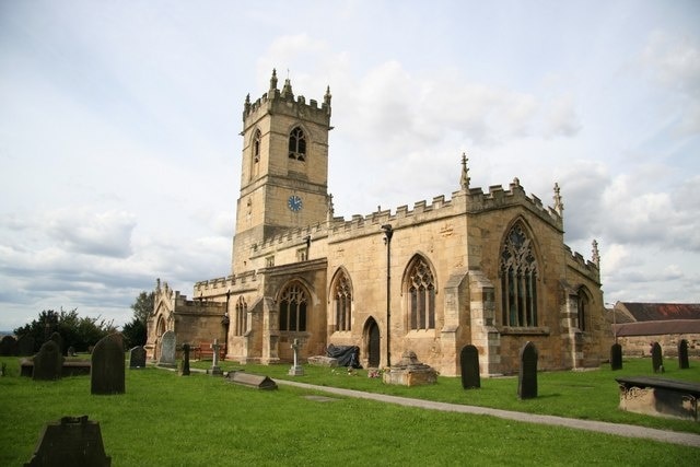 St.Peter's church Norman tower and 15th century crenelations, but the windows are largely early 14th century Decorated with rectilinear tracery