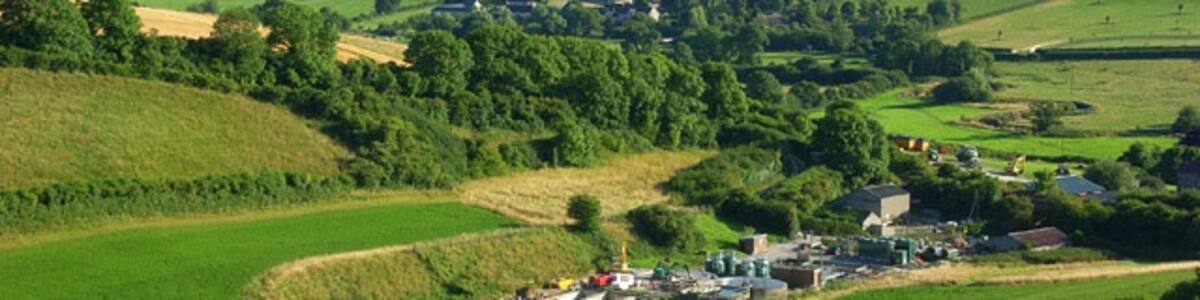 Photo "The Frome valley, Maiden Newton A view towards the hamlet of Cruxton on the far side of the valley. In the foreground is the sewage works at the foot of Langcombe Bottom." by Andrew Smith (Creative Commons Attribution-Share Alike 2.0) / Cropped from original