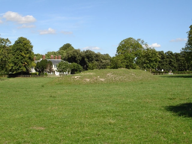 Elbrook House on the far side of a paddock. The paddock would appear to contain a tumulus which is not marked on the OS map.