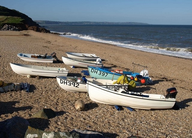 Boats, Hallsands. Boats hauled up on the pebbles at the side of 1490691.