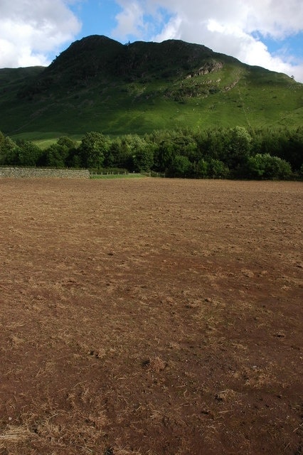 Bare field in Great Langdale. At present some of the meadows in Great Langdale are bare as the National Trust undertake a programme to restore these meadows to traditional meadowland See: 505711. Lingmoor can be seen in the background.