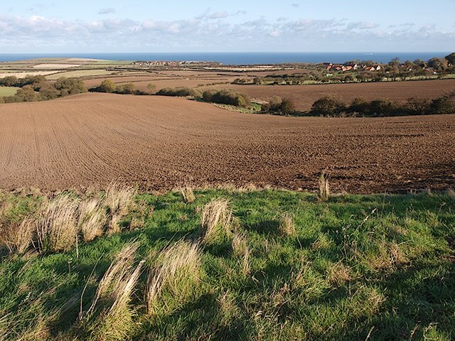 View across farmland near Ellerby The two villages that can be seen are Ellerby on the right and Runswick Bay.