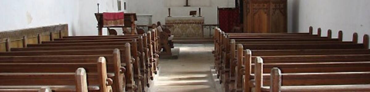 Photo "The church of St Lawrence - view east. Situated beside the busy A151 Norwich to Stalham road. The round tower has distinctive carstone detailing and dates to the 12th century. The nave is 14th century > seen here and 738961 but the church was greatly restored in the 18th century, when the Preston family of Beeston Hall > 738973 took it upon themselves to turn the church into their mausoleum. During this time the interior received its ceiling with Gothick panelling, which imitates that in the entrance of Beeston Hall. The church contains many wall monuments to members of the Preston family > 738949 - 738951; the tomb chest is to Jacob Preston (d. 1683) > 738952. After having been closed to the public due to re-roofing and interior restoration work the church is now again open every day. For more information see: http://www.norfolkchurches.co.uk/beestonstlawrence/beestonstlawrence.htm" by Evelyn Simak (Creative Commons Attribution-Share Alike 2.0) / Cropped from original