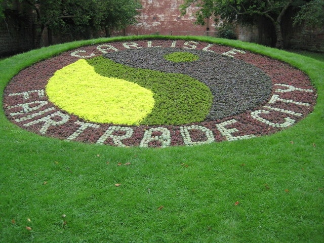 Carlisle Fairtrade City Floral display promoting Carlisle's status as a Fairtrade City. This flower bed is immediately to the east of the cathedral.